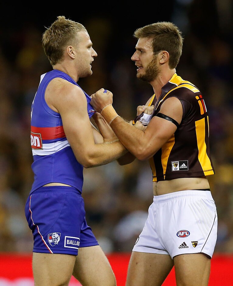 AFL 2016 Rd 03 - Western Bulldogs v Hawthorn MELBOURNE, AUSTRALIA - APRIL 10: Jake Stringer of the Bulldogs and Grant Birchall of the Hawks wrestle during the 2016 AFL Round 03 match between the Western Bulldogs and the Hawthorn Hawks at Etihad Stadium, Melbourne on April 10, 2016. (Photo by Michael Willson/AFL Media)